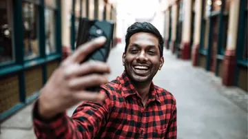 Smiling social media manager